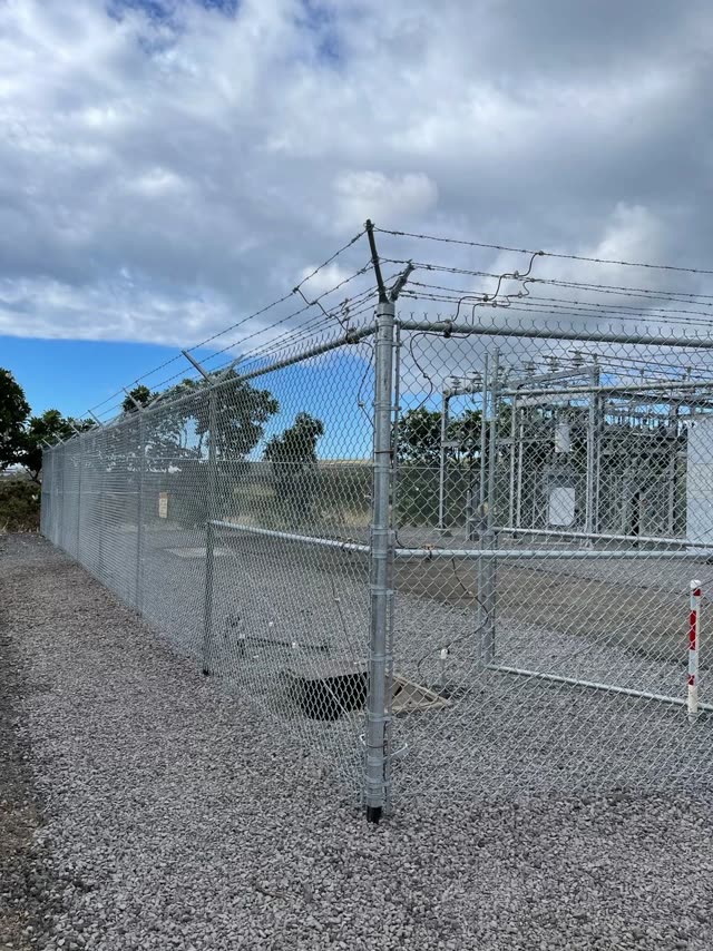 Chain link fence line along a Hilo property